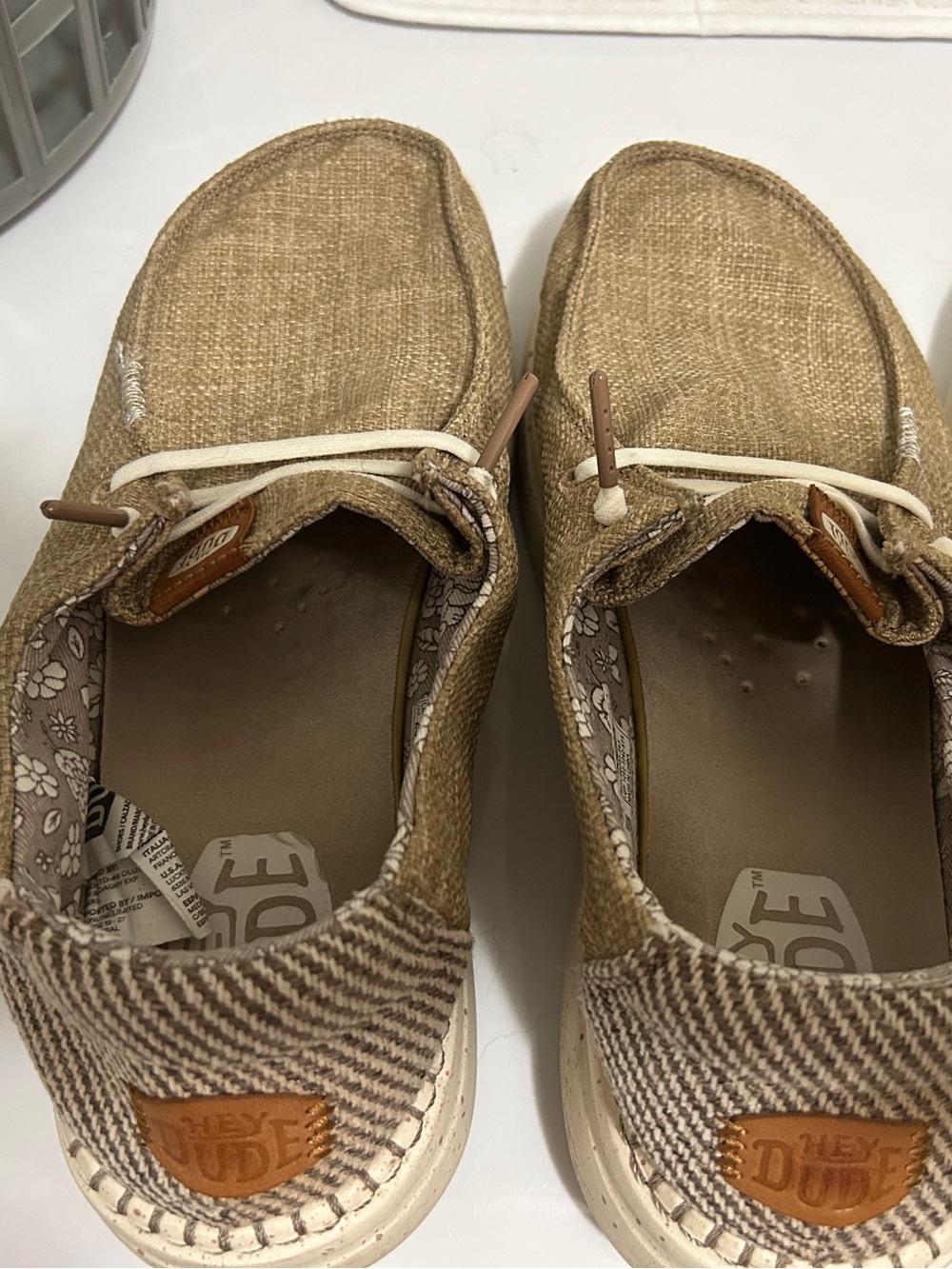 Hey Dude women’s Casual Slip-Ons in Tan and Cream